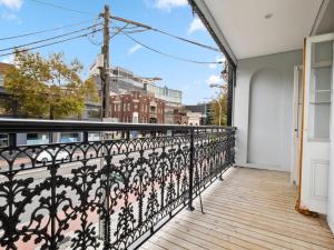 a balcony with a view of a city at VENUS Surry Hills - FEMALE ONLY HOSTEL - Long stay negotiable in Sydney