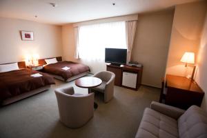 TV a/nebo společenská místnost v ubytování Utazu Grand Hotel