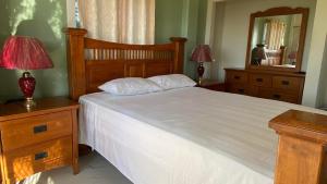 Postel nebo postele na pokoji v ubytování Sky Lodge