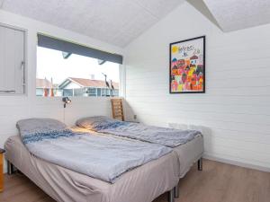 a bed in a room with a window at 5 person holiday home in Aabenraa-By Traum in Aabenraa +32 photos