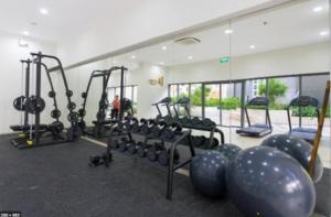 a gym with a bunch of machines in a room at Sarah Homestay - Masteri Thao Dien in Ho Chi Minh City
