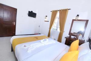 Postel nebo postele na pokoji v ubytování Queensland Hotel