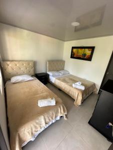 Llit o llits en una habitació de Finca Hotel Villa Celeste