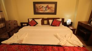 Voodi või voodid majutusasutuse Hotel Osho Home toas
