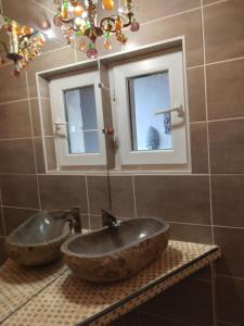 a bathroom with a sink and a mirror at viarhona in Montélimar