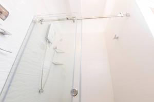a shower with a glass door in a bathroom at LUNA's HOME - Luxury 201 in Tarapoto