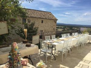 a table set up for a party with a christmas tree on it at Mas provençal dans un lieu exceptionnel in Bollène