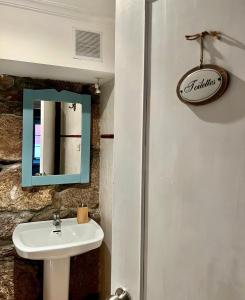 a bathroom with a sink and a mirror at Villa Parra in Santa Cristina de Cobres