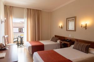 Postel nebo postele na pokoji v ubytování Hotel Marte + 37 fotografií