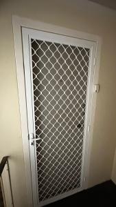 a door with a lattice pattern on it at Macquarie university and Metro nearby in Sydney