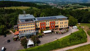 an aerial view of a building in a town at Landhotel Klingerhof in Hösbach
