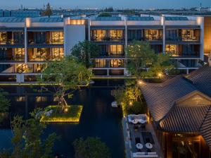 an aerial view of an apartment building at night at Kimpton Bamboo Grove Suzhou, an IHG Hotel in Suzhou