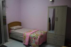 Ένα ή περισσότερα κρεβάτια σε δωμάτιο στο Wafi Guesthouse