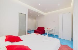 Postel nebo postele na pokoji v ubytování Hotel De Rosa