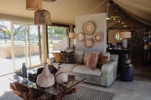 a living room with a couch and a table at Die Boskamp in Marble Hall