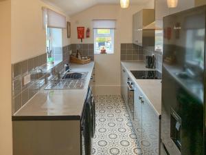 a kitchen with a sink and a counter top at No 1 Overman in Bowburn