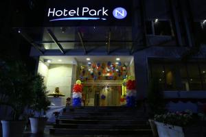 a hotel at night with a sign on the door at Hotel Park N in Vijayawāda