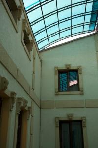 a building with a window and a glass roof at Davan LUX in Tashkent