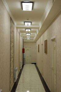 a hallway of a hospital with a long corridor at Davan LUX in Tashkent