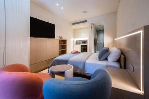 a hotel room with a bed and a tv at Paragon in Sydney