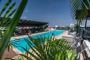 a view of a swimming pool from a building at Onederz Siem Reap in Siem Reap