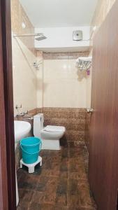 a bathroom with a toilet and a bidet and a sink at HOME STAY NH-7 in Pāonta Sāhib