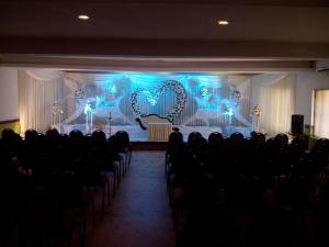 a room with a stage with a heart in the background at Hotel Merlin International in Trichūr