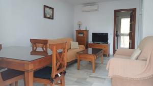 A television and/or entertainment centre at URBANIZACION EL ATARDECER