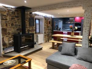 a living room with a couch and a fireplace at Golliber Baserrie in Areatza