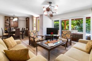 a living room with a couch and a table at Polys Villa Lefkada 1 in Lefkada Town