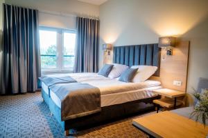 Posteľ alebo postele v izbe v ubytovaní Hotel Turkus + 37 fotografií