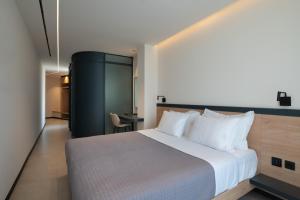 Postel nebo postele na pokoji v ubytování Nema Hotel Athens