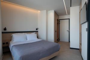 Postel nebo postele na pokoji v ubytování Nema Hotel Athens