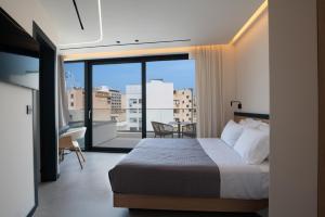 Postel nebo postele na pokoji v ubytování Nema Hotel Athens