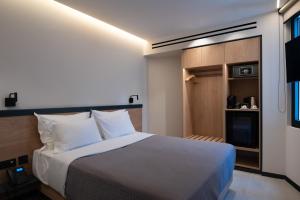 Postel nebo postele na pokoji v ubytování Nema Hotel Athens