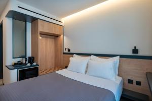 Postel nebo postele na pokoji v ubytování Nema Hotel Athens