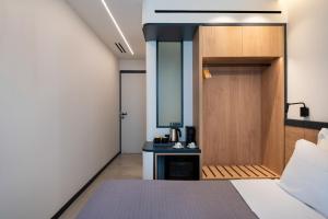 Postel nebo postele na pokoji v ubytování Nema Hotel Athens