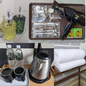 a kitchen with a suitcase with bottles of water and towels at 一中宿屋 in Taichung