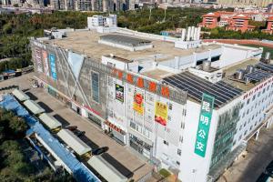 an overhead view of a building in a city at 7 Days Premium - Kunming South High Speed Railway Station University Town Metro Station in Kunming