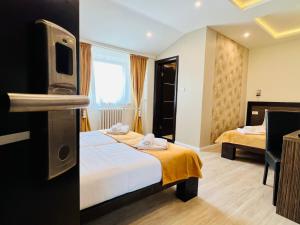 Krevet ili kreveti u jedinici u okviru objekta Side One Design Hotel Garni