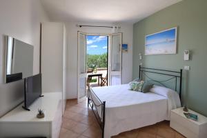 Posteľ alebo postele v izbe v ubytovaní B&B Happy Days Golfo di Gallipoli