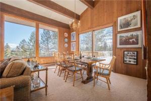 a dining room with a table and chairs at Bray House - Ski-in Ski-out family home in Teton Village