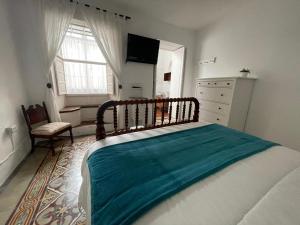 Łóżko lub łóżka w pokoju w obiekcie La Placeta, en Los Llanos