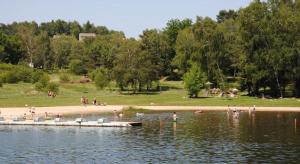 a group of people in the water at a beach at chez Sabine et Bertrand in Beynat