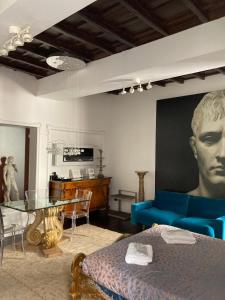 a living room with a couch and a table at D.R.Rome Spanish Luxury Suites in Rome