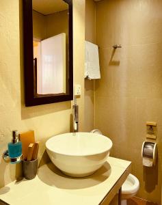 a bathroom with a large white bowl sink on a counter at Sala Boutique Hotel in Male City