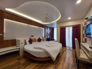 Voodi või voodid majutusasutuse New Gitanjali Hotel, New Digha toas