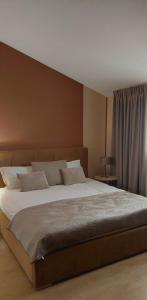 a bedroom with a large bed in a room at Apartaments Victoria in Poreč