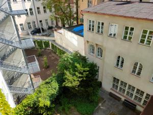 an overhead view of a courtyard in a city with buildings at Vogue apartment near by Wenceslas Square in Prague