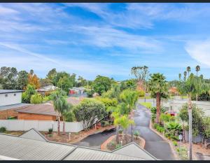 an aerial view of a street with palm trees at Golf Views Apartment in Mulwala